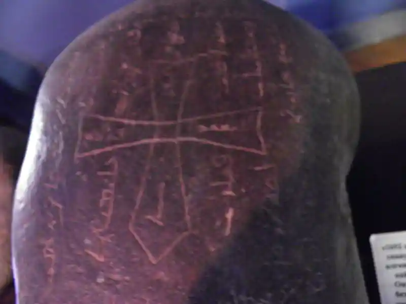 Stone with cross symbol and other inscriptions